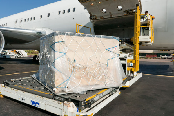 A man loading cargo onto the plane